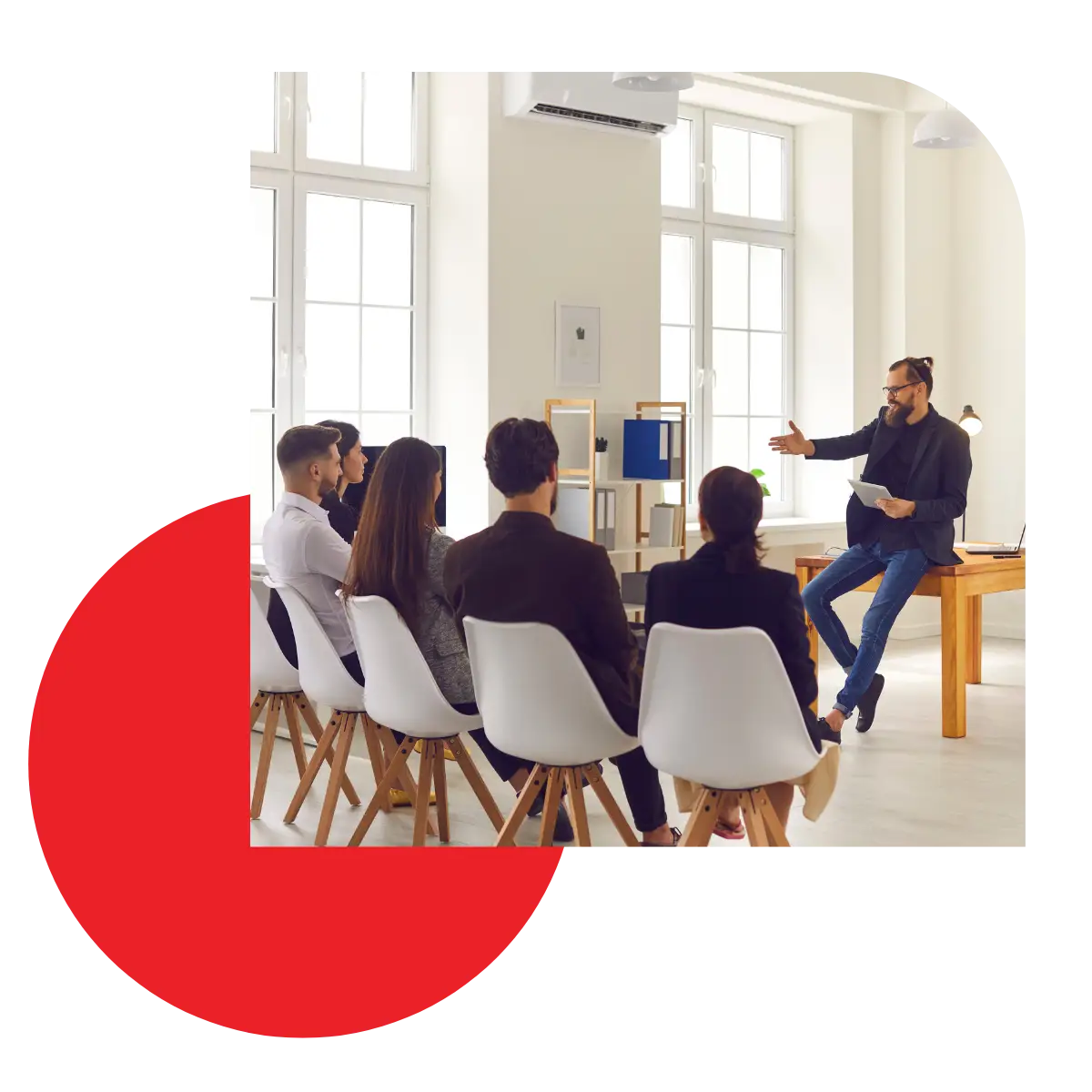 Team leader teaching a group as part of a guide to scaling your business